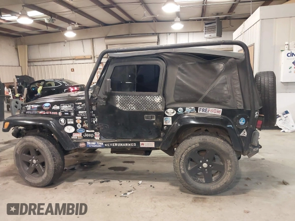 1999 Jeep Wrangler Sahara z VIN 1J4FY49S4XP432567, wystawiony jako IAAI lot #41562455 z przebiegiem Nie podano mil oraz . Historia ofert i sprzedaży dostępna na DreamBid. Obrazek 14.