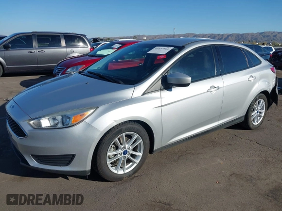 2018 Ford Focus SE z VIN 1FADP3F27JL204873, wystawiony jako IAAI lot #41657504 z przebiegiem 99 224 mil mil oraz . Historia ofert i sprzedaży dostępna na DreamBid. Obrazek 17.