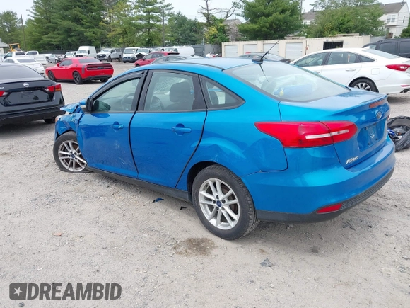 2015 Ford Focus SE z VIN 1FADP3F26FL252212, wystawiony jako IAAI lot #42345763 z przebiegiem 102 549 mil mil oraz . Historia ofert i sprzedaży dostępna na DreamBid. Obrazek 3.