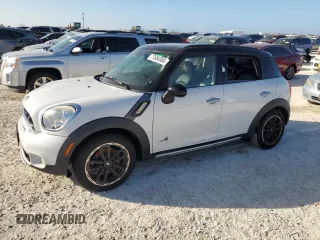 2016 MINI Countryman S with VIN WMWZC5C51GWU01290, listed as a Copart auction lot 77684384 with 106,811 mi miles and Salvage Title. Bid and sale history available at DreamBid. Image 1.