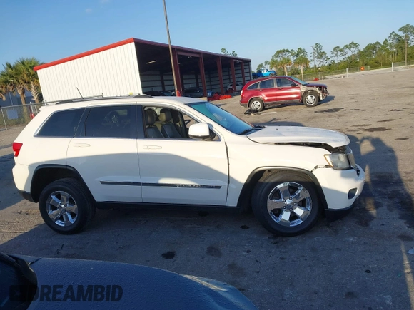2011 Jeep Grand Cherokee Laredo with VIN 1J4RS4GGXBC739433, listed as a IAAI auction lot 41794031 with 174,672 mi miles and . Bid and sale history available at DreamBid. Image 14.