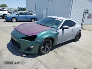 2013 Scion FR-S z VIN JF1ZNAA12D2721085, wystawiony jako Copart lot #60166495 z przebiegiem 141 424 mil mil oraz Szkoda całkowita • Salvage title. Historia ofert i sprzedaży dostępna na DreamBid. Obrazek 1.