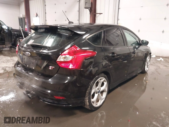2014 Ford Focus ST with VIN 1FADP3L91EL375674, listed as a IAAI auction lot 41572329 with 100,253 mi miles and . Bid and sale history available at carsss.com. Image 4.
