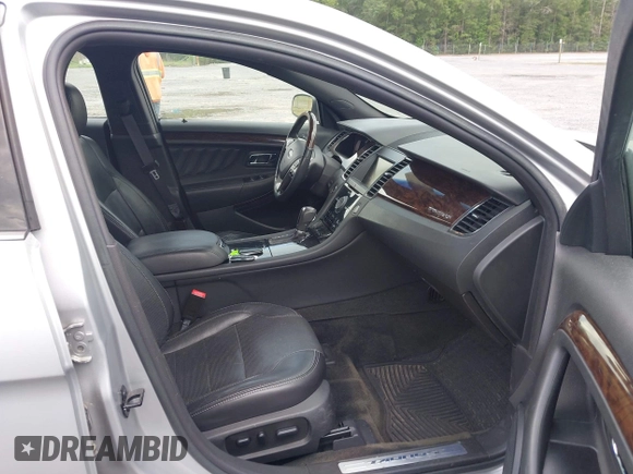2013 Ford Taurus Limited with VIN 1FAHP2F87DG235392, listed as a IAAI auction lot 42431543 with 123,904 mi miles and . Bid and sale history available at DreamBid. Image 5.
