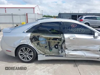 2015 Lincoln MKZ z VIN 3LN6L2GK5FR622117, wystawiony jako IAAI lot #42164455 z przebiegiem 167 156 mil mil oraz . Historia ofert i sprzedaży dostępna na DreamBid. Obrazek 6.