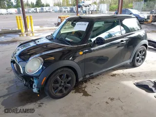2010 MINI Cooper Hardtop with VIN WMWMF3C57ATZ65458, listed as a IAAI auction lot 41953118 with 106,047 mi miles. Bid and sale history available at carsss.com. Image 18.