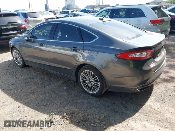 2015 Ford Fusion SE z VIN 3FA6P0H98FR275848, wystawiony jako IAAI lot #42311852 z przebiegiem 197 536 mil mil oraz . Historia ofert i sprzedaży dostępna na DreamBid. Obrazek 3.