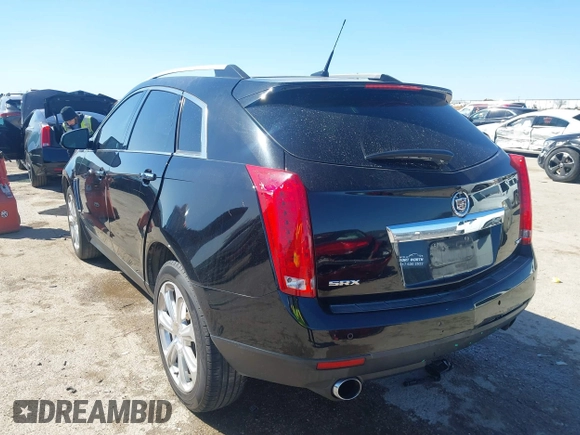 2014 Cadillac SRX Performance Collection z VIN 3GYFNCE35ES517868, wystawiony jako IAAI lot #41775522 z przebiegiem 166 960 mil mil oraz . Historia ofert i sprzedaży dostępna na DreamBid. Obrazek 3.