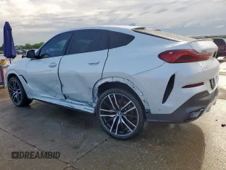 2023 BMW X6 xDrive40i z VIN 5UXCY6C08P9N43749, wystawiony jako Copart lot #54092795 z przebiegiem 39 495 mil mil oraz Szkody całkowita. Historia ofert i sprzedaży dostępna na DreamBid. Obrazek 2.