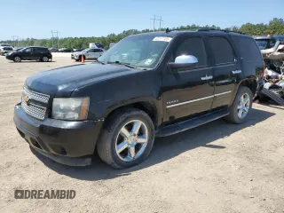 2012 Chevrolet Tahoe LTZ z VIN 1GNSCCE06CR247055, wystawiony jako Copart lot #52577105 z przebiegiem 278 579 mil mil oraz Czysty tytuł • Clean title. Historia ofert i sprzedaży dostępna na DreamBid. Obrazek 1.