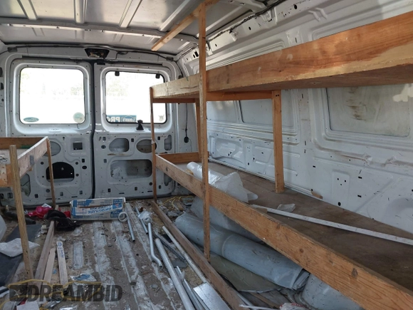 1999 Ford Econoline Cargo with VIN 1FTRE1420XHA34056, listed as a IAAI auction lot 41998411 with 236,267 mi miles. Bid and sale history available at carsss.com. Image 8.