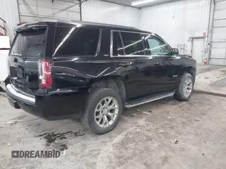 2016 GMC Yukon SLT with VIN 1GKS2BKC9GR176948, listed as a IAAI auction lot 41361221 with 125,178 mi miles. Bid and sale history available at carsss.com. Image 4.