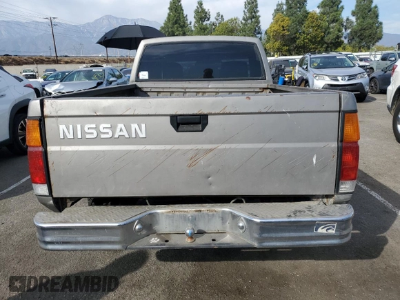1987 Nissan Hardbody E z VIN JN6ND11SXHW014073, wystawiony jako Copart lot #78956934 z przebiegiem 381 885 mil mil oraz Szkody całkowita. Historia ofert i sprzedaży dostępna na DreamBid. Obrazek 6.