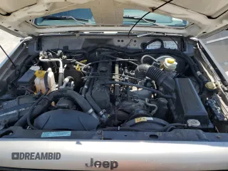 2000 Jeep Cherokee SE with VIN 1J4FF28SXYL140930, listed as a Copart auction lot 59191035 with 248,598 mi miles and Salvage title. Bid and sale history available at DreamBid. Image 12.