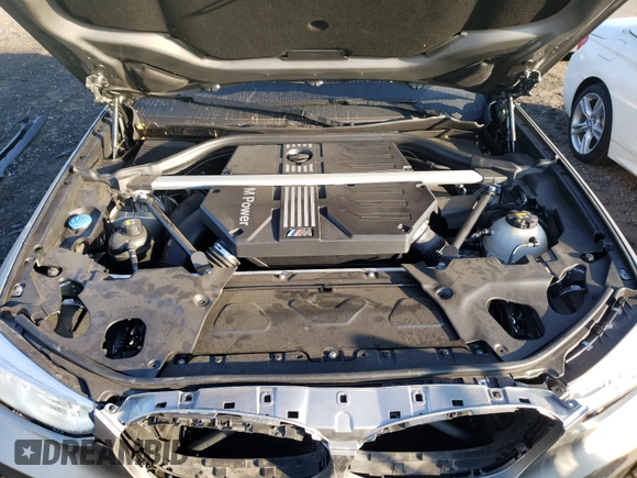 2021 BMW X4 M z VIN 5YMUJ0C00M9F77102, wystawiony jako Copart lot #59472373 z przebiegiem 5 041 mil mil oraz . Historia ofert i sprzedaży dostępna na DreamBid. Obrazek 7.