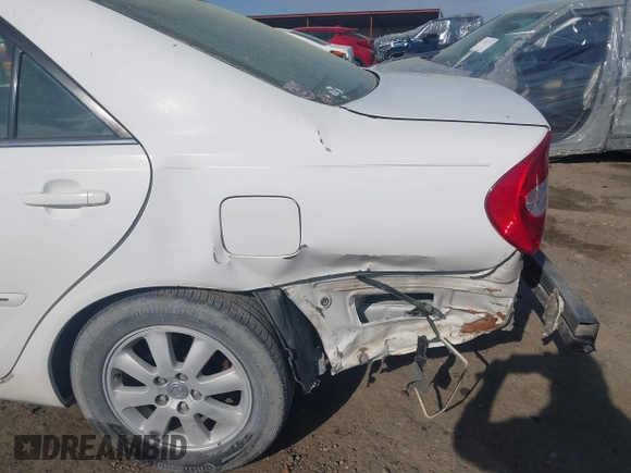 2003 Toyota Camry LE with VIN 4T1BE32K33U249945, listed as a IAAI auction lot 41907000 with 279,723 mi miles and . Bid and sale history available at DreamBid. Image 14.