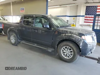 2014 Nissan Frontier SV with VIN 1N6AD0EV9EN710020, listed as a Copart auction lot 60895575 with 125,090 mi miles and Salvage title. Bid and sale history available at DreamBid. Image 4.