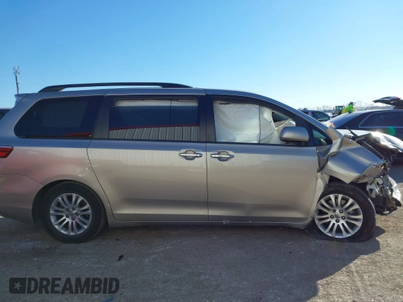 2015 Toyota Sienna XLE with VIN 5TDYK3DC8FS547056, listed as a IAAI auction lot 41387793 with 140,767 mi miles and . Bid and sale history available at DreamBid. Image 14.
