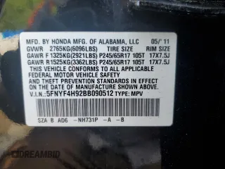 2011 Honda Pilot Touring z VIN 5FNYF4H92BB090512, wystawiony jako Copart lot #57046015 z przebiegiem 159 814 mil mil oraz Szkoda całkowita • Salvage title. Historia ofert i sprzedaży dostępna na DreamBid. Obrazek 13.