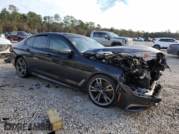 2020 BMW 5 Series M550i xDrive with VIN WBAJS7C01LCD23365, listed as a Copart auction lot 88302885 with Not provided miles and Salvage title. Bid and sale history available at DreamBid. Image 4.