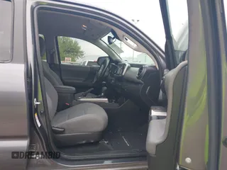 2018 Toyota Tacoma SR5 with VIN 5TFAZ5CN5JX062498, listed as a IAAI auction lot 41867393 with 128,879 mi miles and . Bid and sale history available at DreamBid. Image 5.