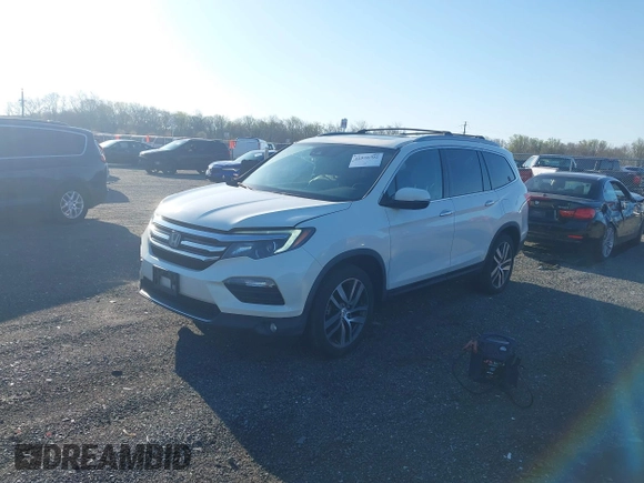 2017 Honda Pilot Elite with VIN 5FNYF6H00HB032386, listed as a IAAI auction lot 41976702 with 153,251 mi miles and . Bid and sale history available at DreamBid. Image 17.