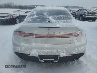 2015 Lincoln MKZ z VIN 3LN6L2JK7FR608177, wystawiony jako Copart lot #85162384 z przebiegiem Nie podano mil oraz Czysty tytuł • Clean title. Historia ofert i sprzedaży dostępna na DreamBid. Obrazek 6.