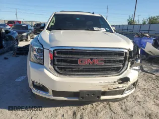 2015 GMC Yukon XL SLT with VIN 1GKS1HKC6FR166415, listed as a Copart auction lot 73029014 with 105,209 mi miles and Salvage Title. Bid and sale history available at carsss.com. Image 5.