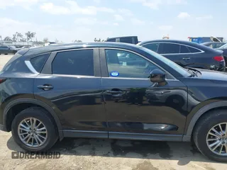 2017 Mazda CX-5 Touring with VIN JM3KFACL0H0124632, listed as a IAAI auction lot 42134971 with 107,029 mi miles and . Bid and sale history available at carsss.com. Image 13.