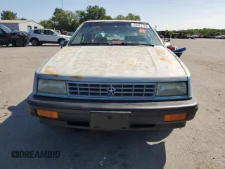 1992 Plymouth Sundance z VIN 1P3XP24D7NN120553, wystawiony jako Copart lot #68472794 z przebiegiem 148 535 mil mil oraz Szkody całkowita. Historia ofert i sprzedaży dostępna na DreamBid. Obrazek 5.