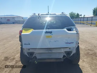 2014 Jeep Cherokee Trailhawk with VIN 1C4PJMBSXEW236807, listed as a IAAI auction lot 42660980 with 157,225 mi miles and . Bid and sale history available at DreamBid. Image 17.