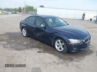 2013 BMW 3 Series 328i xDrive with VIN WBA3B5G53DNS02293, listed as a IAAI auction lot 42012883 with 243,490 mi miles. Bid and sale history available at carsss.com. Image 1.
