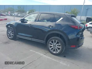 2021 Mazda CX-5 Grand Touring with VIN JM3KFBDM4M1426197, listed as a IAAI auction lot 42004644 with 43,814 mi miles. Bid and sale history available at carsss.com. Image 3.