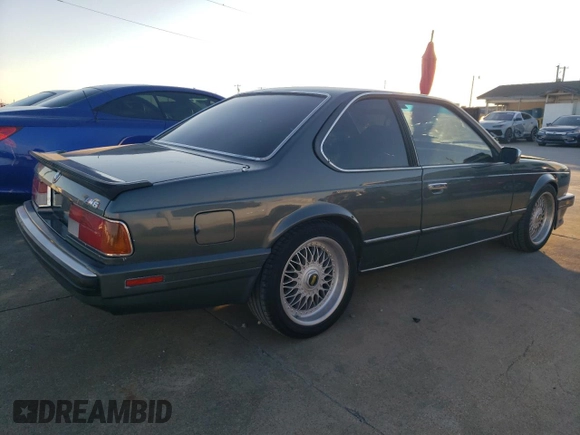 1987 BMW M6 z VIN WBAEE1405H2560004, wystawiony jako Copart lot #85741934 z przebiegiem 124 692 mil mil oraz Czysty tytuł • Clean title. Historia ofert i sprzedaży dostępna na DreamBid. Obrazek 3.