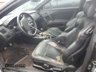 2003 Hyundai Tiburon GT z VIN KMHHN65F13U084620, wystawiony jako Copart lot #46880185 z przebiegiem Nie podano mil oraz Nie do naprawy • Non repairable. Historia ofert i sprzedaży dostępna na DreamBid. Obrazek 7.