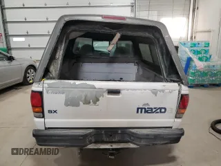 2000 Mazda B-Series 2WD Truck SX with VIN 4F4YR12CXYTM35082, listed as a Copart auction lot 82168854 with 0 mi miles and Salvage Title. Bid and sale history available at carsss.com. Image 6.
