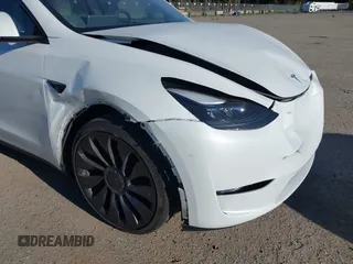 2023 Tesla Model Y Performance with VIN 7SAYGDEF2PF754938, listed as a IAAI auction lot 42067041 with 21,103 mi miles and . Bid and sale history available at DreamBid. Image 6.