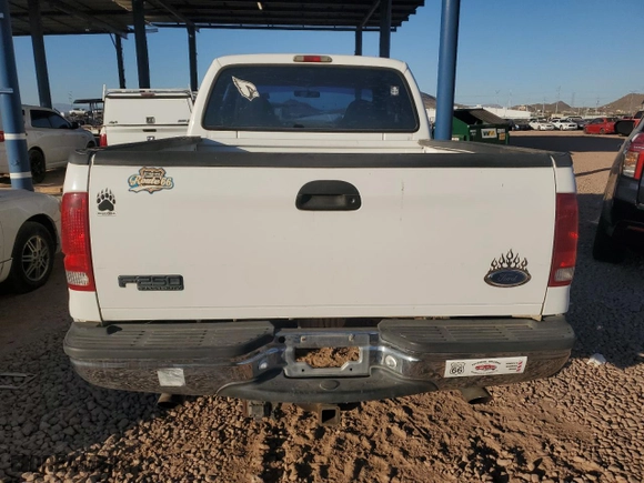 1999 Ford Super Duty F-250 XL with VIN 1FTNX21L5XEE86694, listed as a Copart auction lot 41697885 with 153,948 mi miles and Salvage Title. Bid and sale history available at carsss.com. Image 6.
