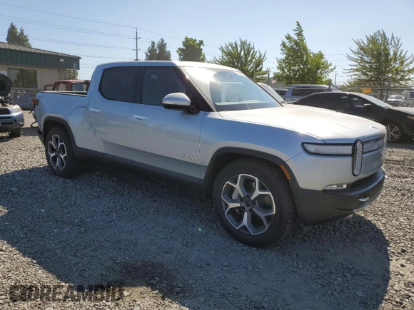 2023 Rivian R1T Adventure z VIN 7FCTGBAA0PN025046, wystawiony jako Copart lot #62502274 z przebiegiem 1385 mil mil oraz Szkody całkowita. Historia ofert i sprzedaży dostępna na DreamBid. Obrazek 4.