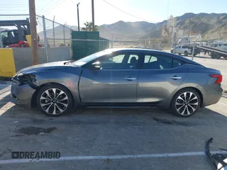 2018 Nissan Maxima Platinum z VIN 1N4AA6AP7JC392710, wystawiony jako IAAI lot #41866951 z przebiegiem 49 026 mil mil oraz . Historia ofert i sprzedaży dostępna na DreamBid. Obrazek 14.