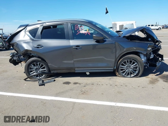 2019 Mazda CX-5 Touring with VIN JM3KFACM1K0533142, listed as a IAAI auction lot 41880181 with Not Provided miles and . Bid and sale history available at carsss.com. Image 13.