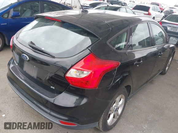 2014 Ford Focus SE with VIN 1FADP3K28EL375367, listed as a IAAI auction lot 42116798 with 129,380 mi miles. Bid and sale history available at carsss.com. Image 4.