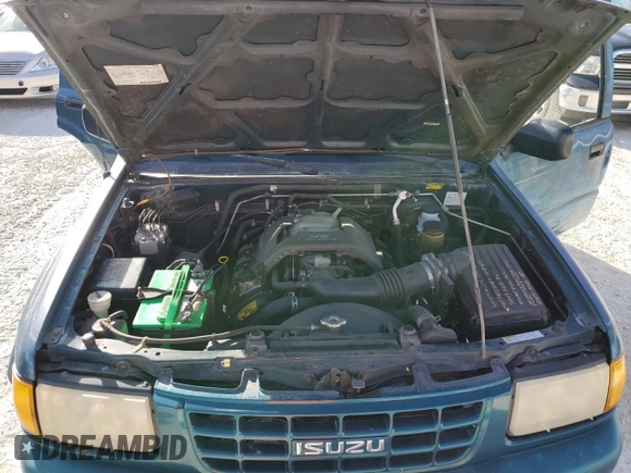 1999 Isuzu Rodeo S with VIN 4S2CK58W0X4378100, listed as a Copart auction lot 78462184 with Not provided miles and Salvage title. Bid and sale history available at DreamBid. Image 12.