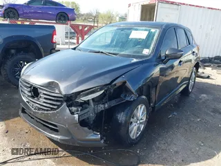 2016 Mazda CX-5 Touring with VIN JM3KE4CY3G0672977, listed as a IAAI auction lot 41889137 with 130,593 mi miles. Bid and sale history available at carsss.com. Image 2.