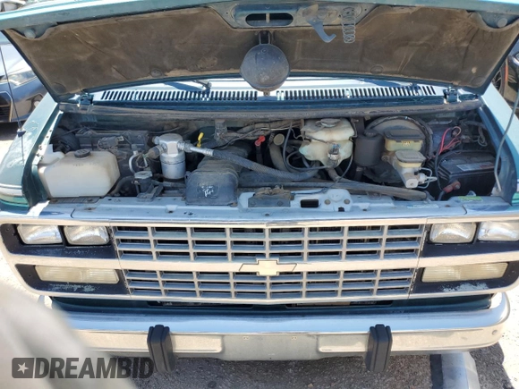 1994 Chevrolet Chevy Van z VIN 1GBEG25K9RF176079, wystawiony jako Copart lot #65824634 z przebiegiem 180 507 mil mil oraz Czysty tytuł • Clean title. Historia ofert i sprzedaży dostępna na DreamBid. Obrazek 12.