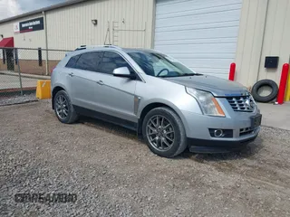 2015 Cadillac SRX Premium Collection z VIN 3GYFNDE36FS610650, wystawiony jako IAAI lot #42286525 z przebiegiem 79 412 mil mil oraz . Historia ofert i sprzedaży dostępna na DreamBid. Obrazek 1.