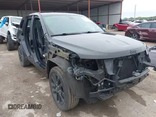 2018 Jeep Grand Cherokee Laredo E with VIN 1C4RJFAG5JC280033, listed as a IAAI auction lot 41953744 with 69,269 mi miles and . Bid and sale history available at DreamBid. Image 1.