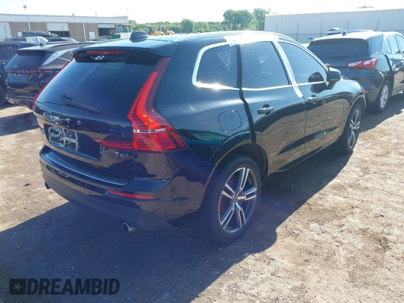 2018 Volvo XC60 Momentum with VIN YV4A22RK3J1040015, listed as a IAAI auction lot 42098399 with 57,130 mi miles and . Bid and sale history available at DreamBid. Image 4.
