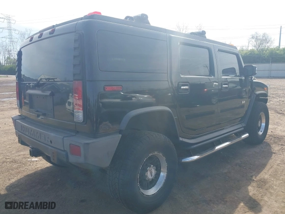 2005 Hummer H2 SUV with VIN 5GRGN23U05H128420, listed as a IAAI auction lot 41983395 with 194,925 mi miles. Bid and sale history available at carsss.com. Image 4.