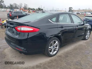 2016 Ford Fusion SE Hybrid with VIN 3FA6P0LU5GR356433, listed as a IAAI auction lot 41799204 with 157,670 mi miles. Bid and sale history available at carsss.com. Image 4.